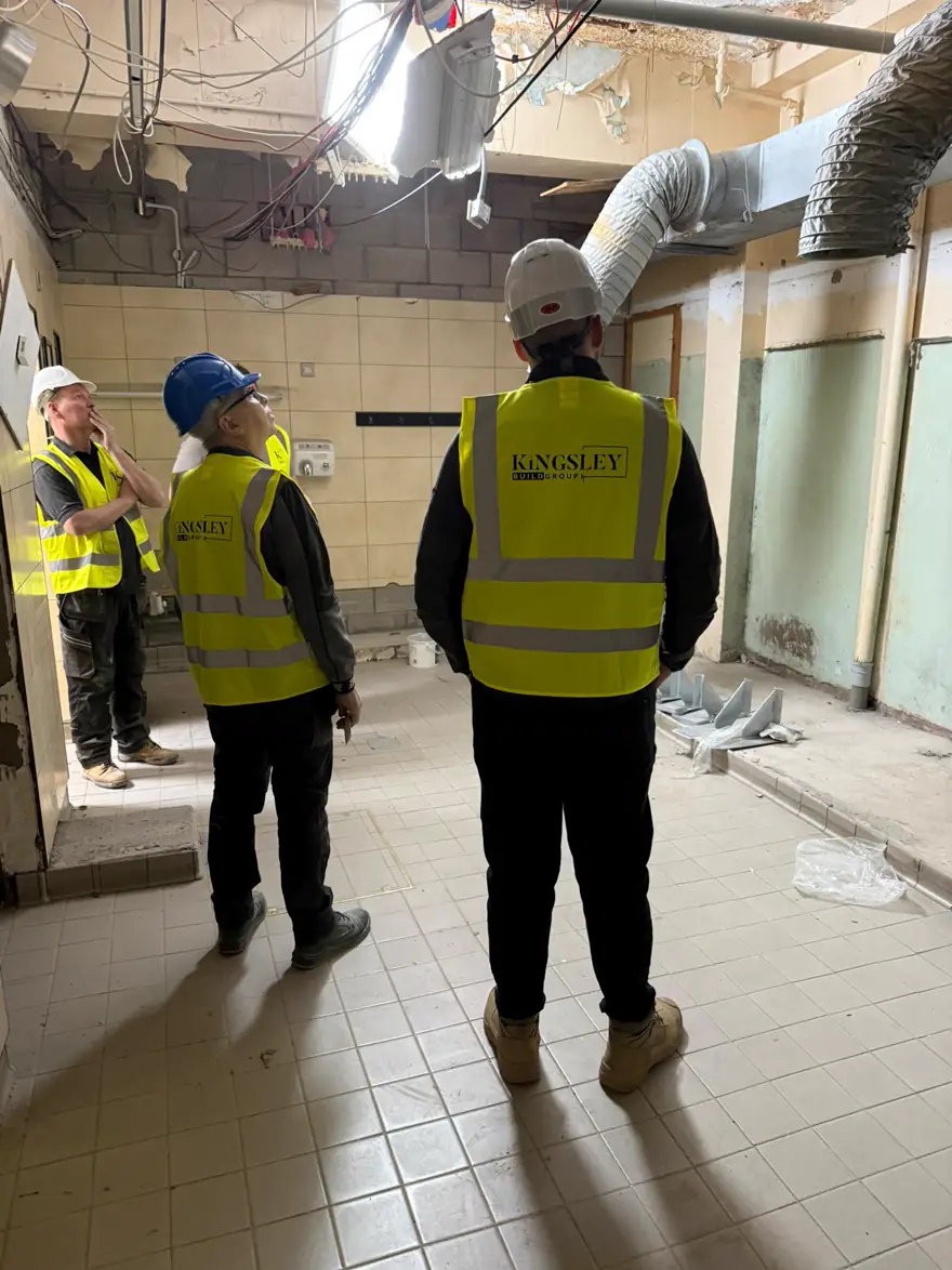 Kingsley team surveying a stripped plant room before refurbishment